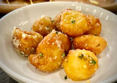 Ruhlman's Garlic parmesan cheese stuffed crispy potatoes