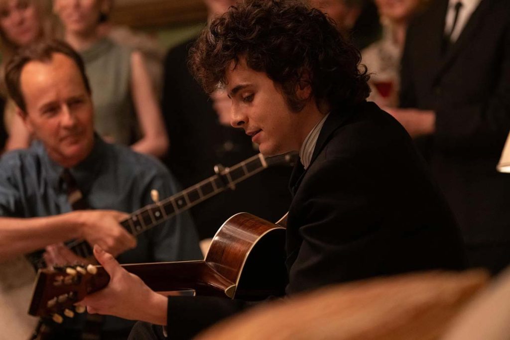 Edward Norton as Pete Seeger and Timothée Chalamet as Bob Dylan