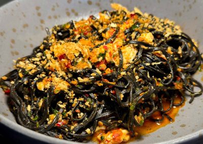 Squid ink taglierini and crab
