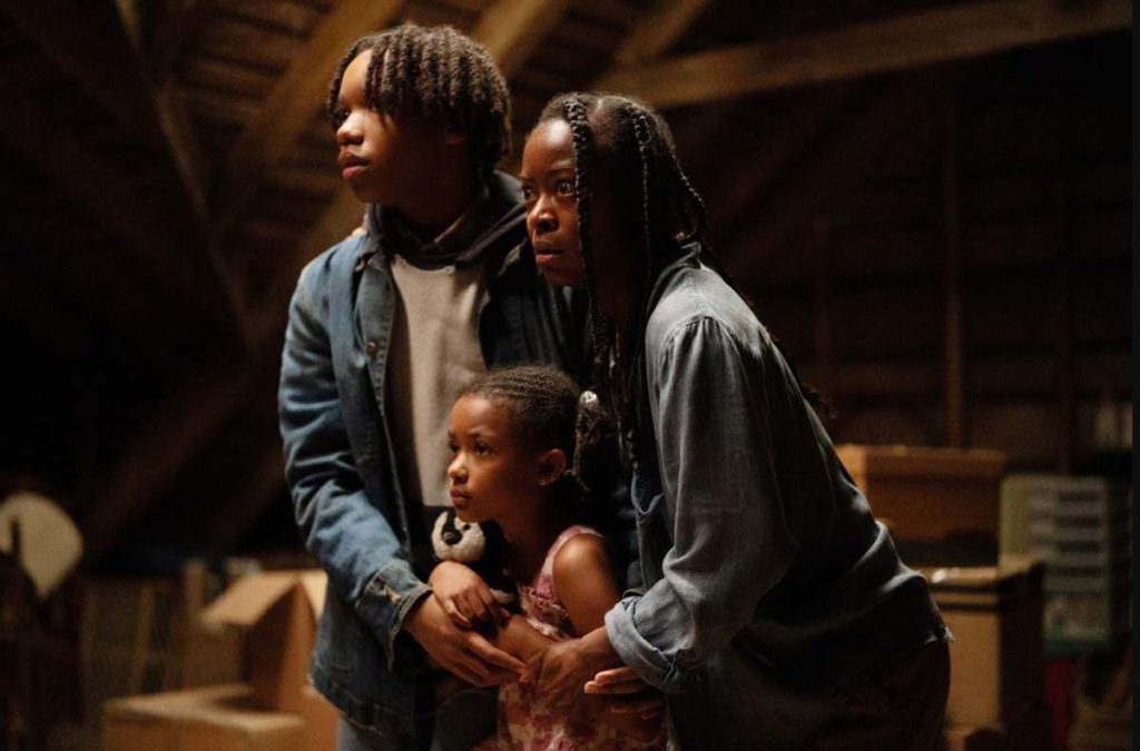 The family faces the Woman in their attic