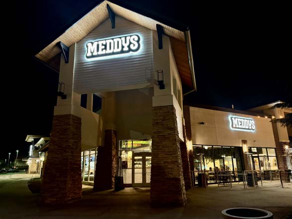 Exterior of new Village Point restaurant Meddys at night