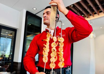A gaucho ready to serve the grilled shrimp