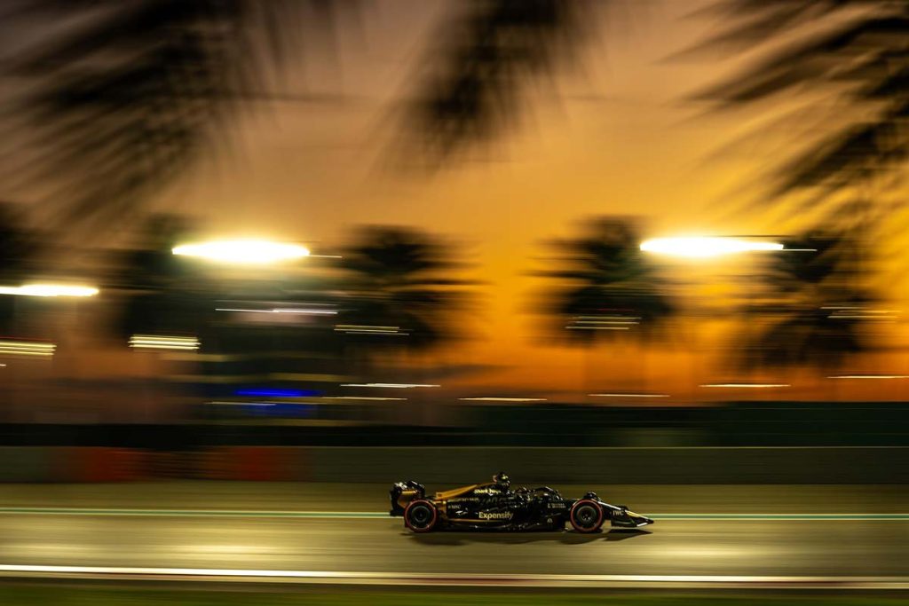 F1 racecar in action at dusk
